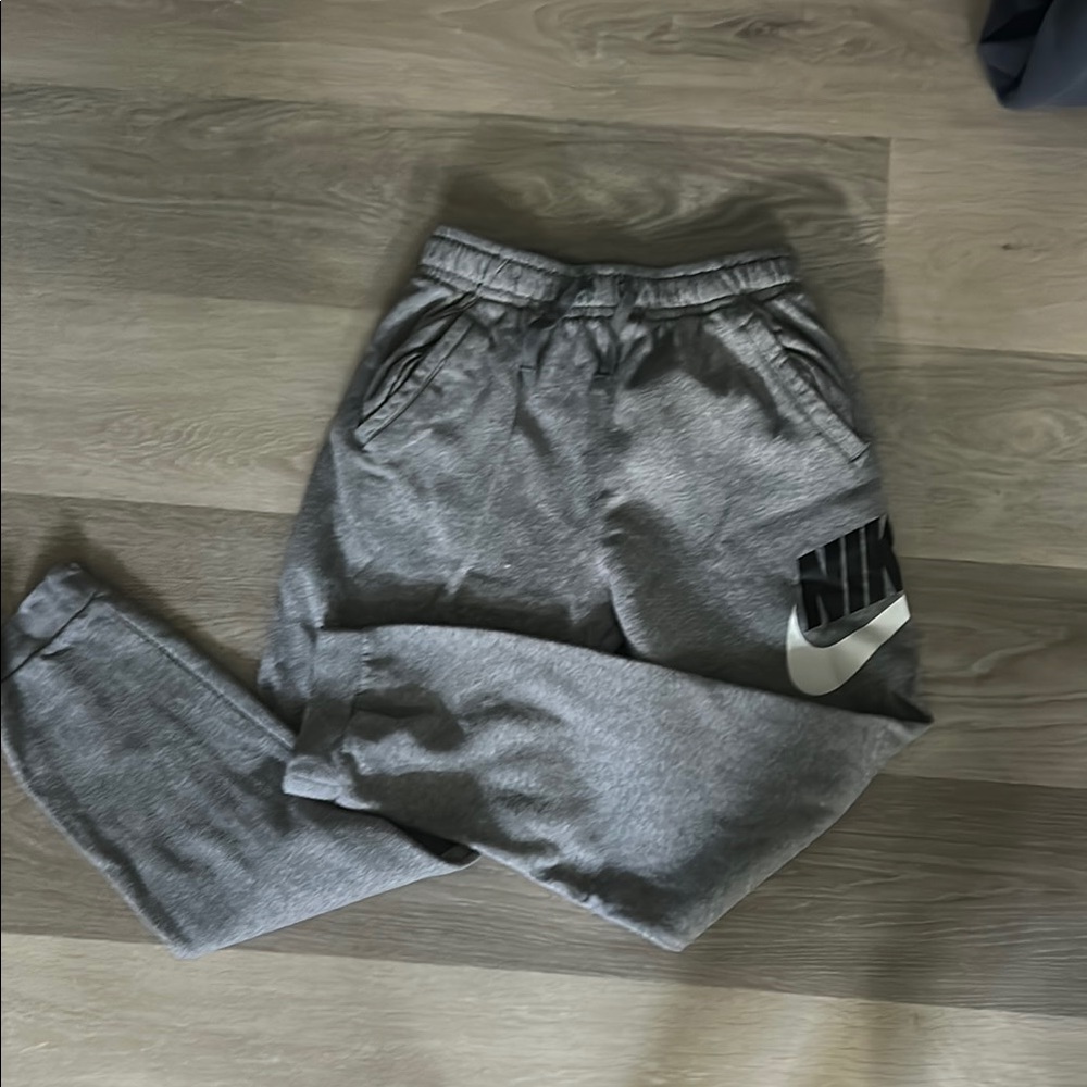 Nike Gray Sweatpants with Elastic Waistband and Tapered Ankle